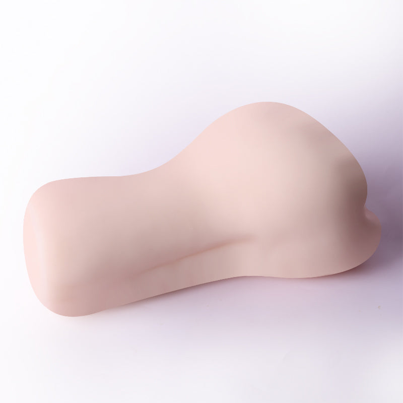 Smooth flesh-toned male masturbator with curved ergonomic design for realistic feel