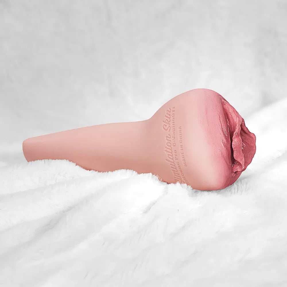 Realistic pink male masturbator with textured vaginal opening and simulation skin material