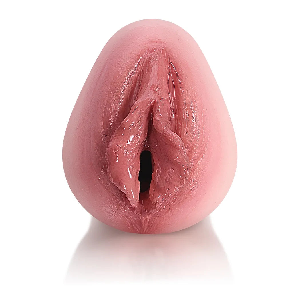 Realistic pink male masturbator with detailed labia and textured interior for enhanced sensation