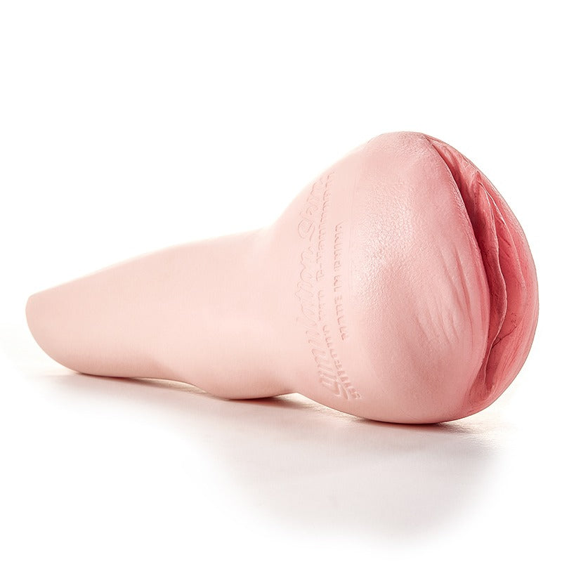 Realistic pink male masturbator with textured vaginal opening and smooth silicone body