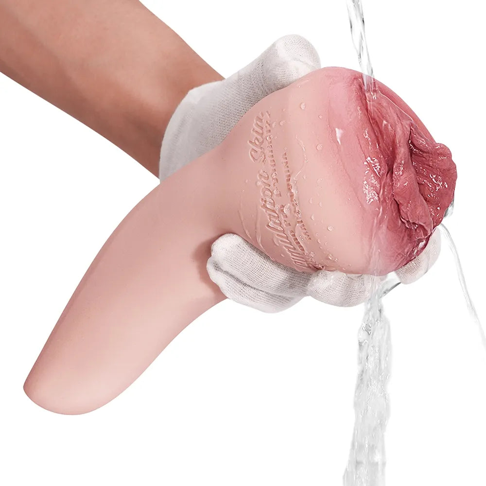 Realistic pink silicone male masturbator with textured interior, being rinsed under water, held in gloved hand