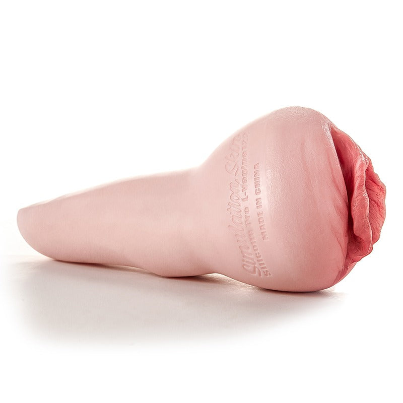 Realistic pink silicone male masturbator with textured labia and embossed branding, designed for lifelike sensation.