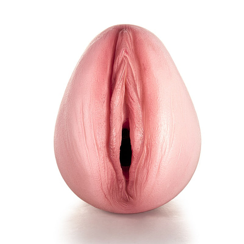 Realistic pink flesh-toned male masturbator with detailed labia and vaginal opening, smooth soft texture