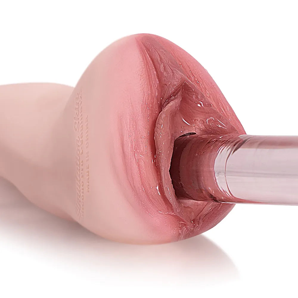 Realistic pink silicone male masturbator with detailed vaginal texture and clear inner tunnel