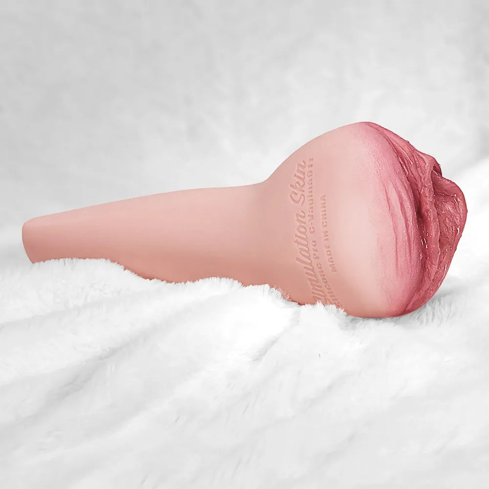 Realistic pink male masturbator with textured vaginal opening and simulation skin finish on white fur